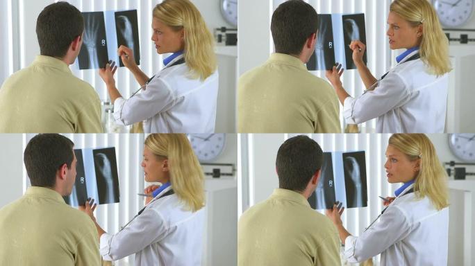 女医生对男性患者进行x光检查