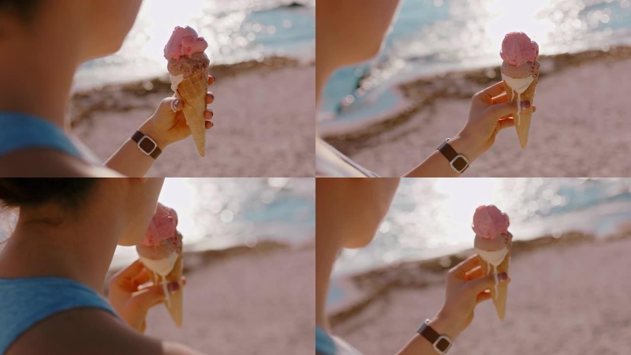 特写女人在美丽的阳光海滩上拿着冰淇淋甜点享受暑假吃软