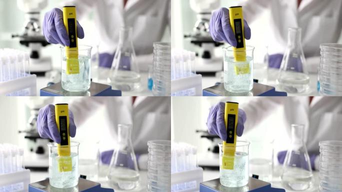 科学家使用化学溶液和实验室测试水质或pH计在实验室