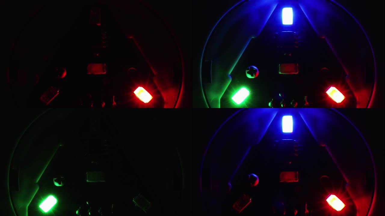 电子板特写上的红色、蓝色和绿色发光二极管闪烁。电子学