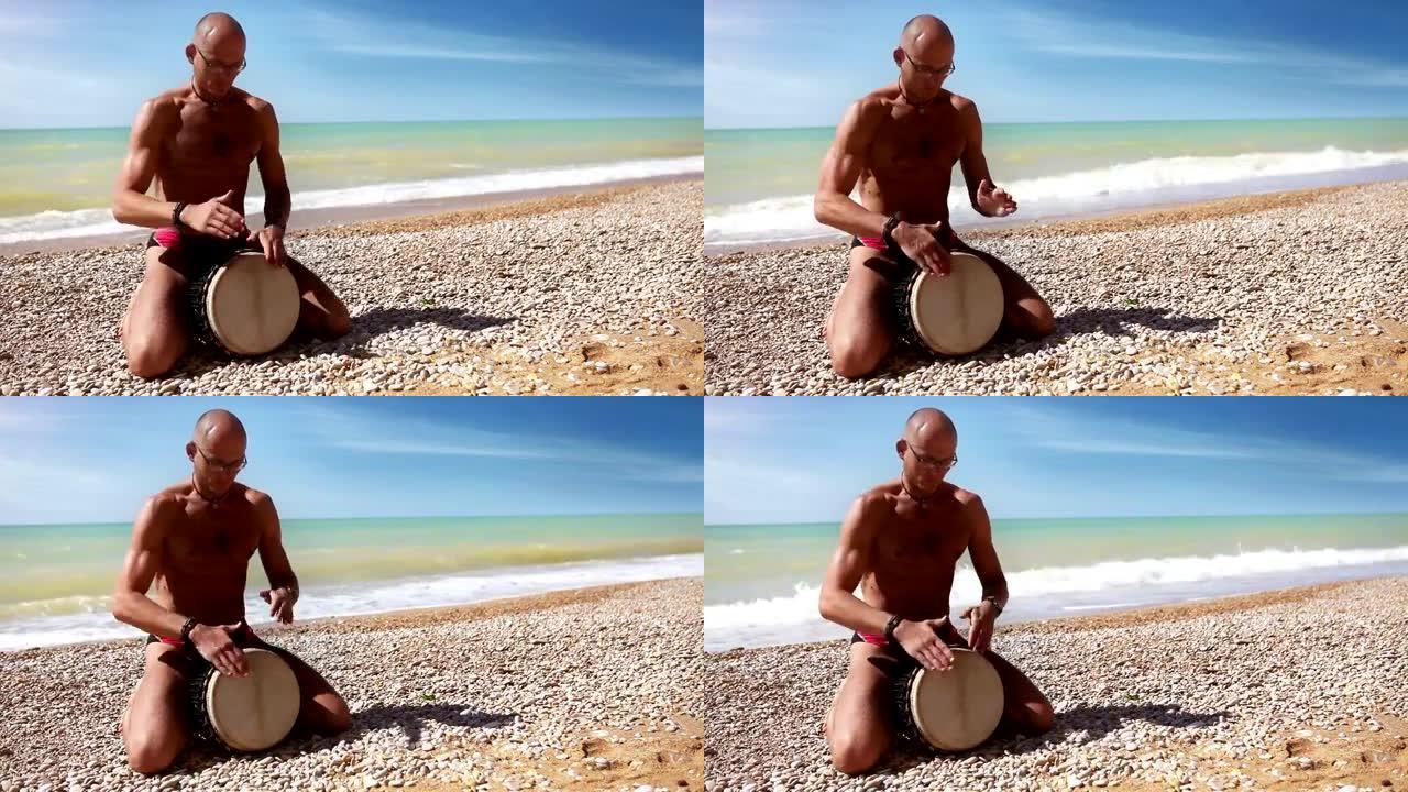 Djembe传统鼓手在孤独的海岸击败rythm