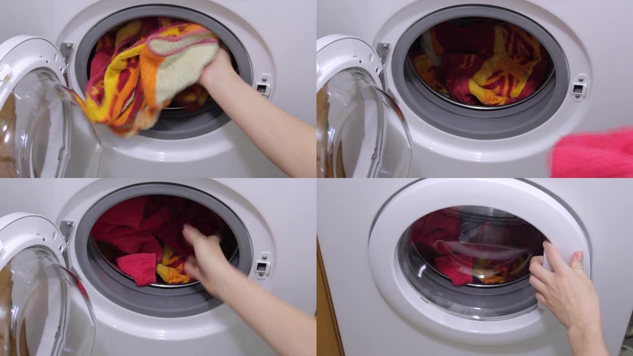 女人把衣服放在洗衣机里