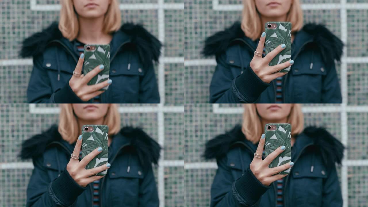年轻女子使用智能手机发短信在城市在线等待社交媒体消息
