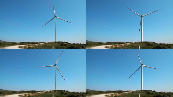释放风的力量。风力发电机对抗蓝天。可再生能源概念。