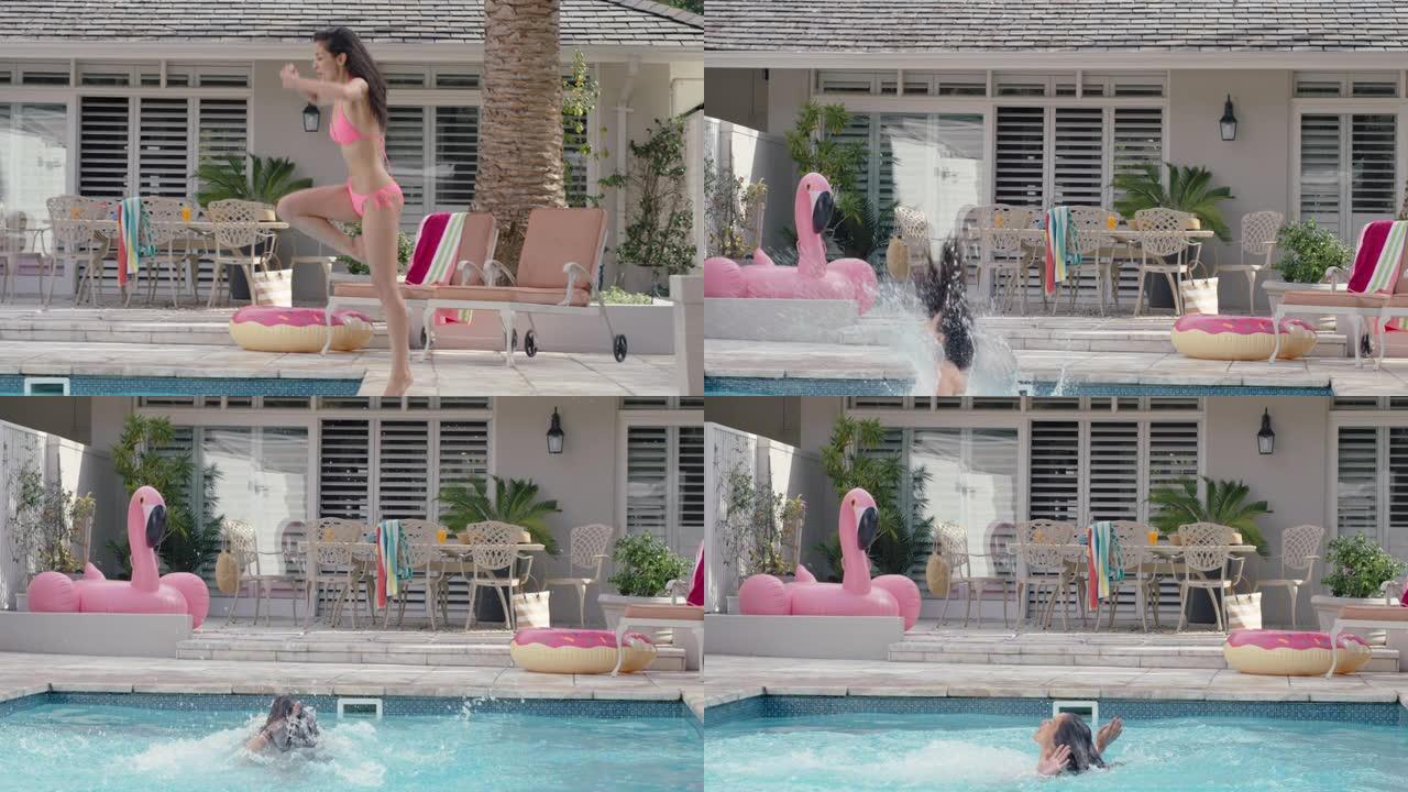 美丽的女人跳进游泳池嬉戏玩得开心暑假享受夏天穿着粉色比基尼4k镜头
