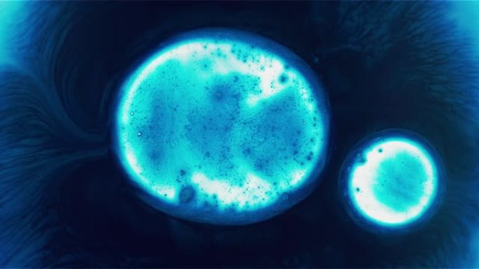 发光的蓝色细胞液滴融合在一起背景