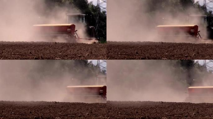 拖拉机肥料产生的灰尘在田间制备土壤