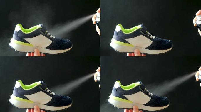 一名妇女从装有防水液体的圆柱体上喷洒喷雾剂到儿童鞋上。护理鞋子，消除难闻的气味。