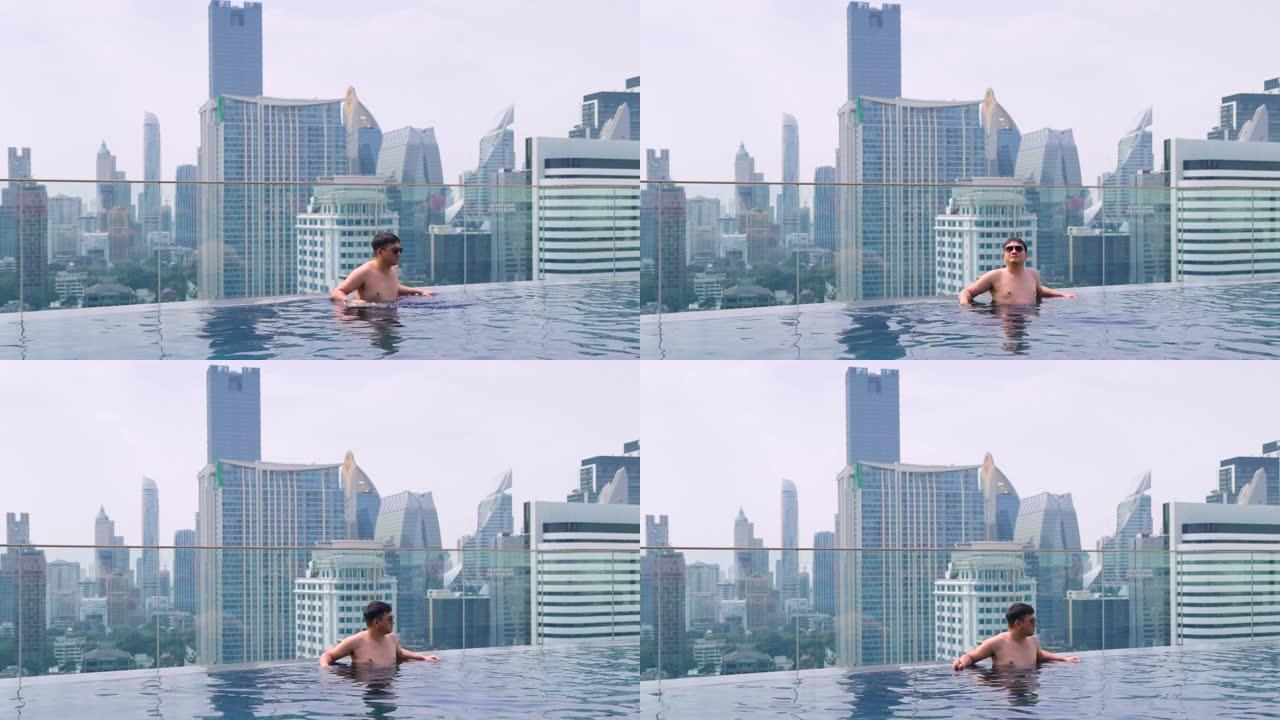 在泰国曼谷的高层建筑的屋顶上放松和游泳。