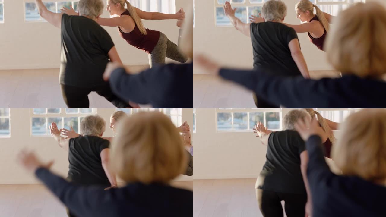 老年妇女瑜伽课锻炼健康冥想练习舞蹈主姿势，教练展示姿势享受日出时工作室的早晨体能锻炼