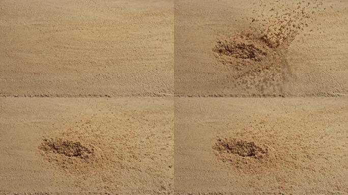 SLO MO LD子弹从侧面击中沙子并导致沙子飞向空中