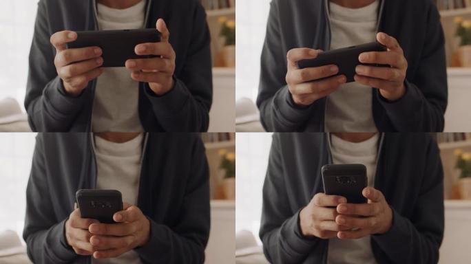 年轻的十几岁的男孩使用智能手机在社交媒体上浏览在线短信玩得开心玩手机游戏在家放松4k
