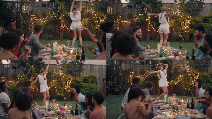 快乐的年轻女子和朋友跳舞庆祝晚上享受晚宴庆祝活动在家里4k后院玩得开心有趣的舞蹈聚会