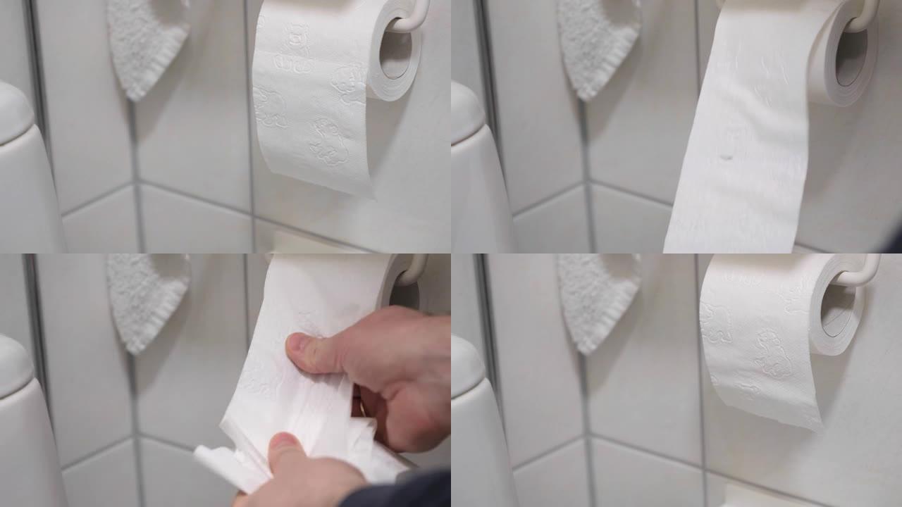 在厕所里，一个男人的手在支架上换了一卷卫生纸。