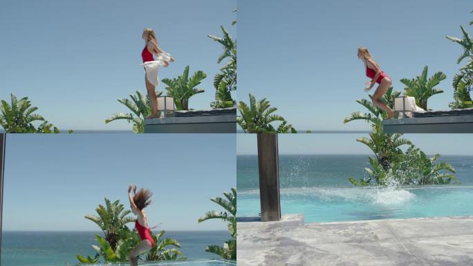 美丽的女人在豪华酒店的游泳池里跳，享受在热带度假胜地游泳，海景，在温暖的阳光明媚的日子里享受有趣的暑