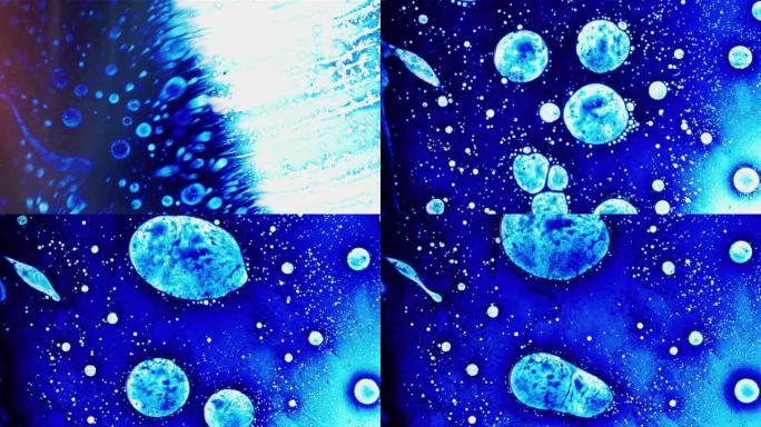 发光的蓝色细胞液滴在太空背景中快速移动