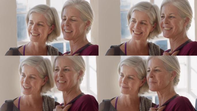 肖像美丽的老年妇女双胞胎姐妹享受瑜伽课微笑快乐的中年兄弟姐妹在健身工作室练习健康健身生活方式