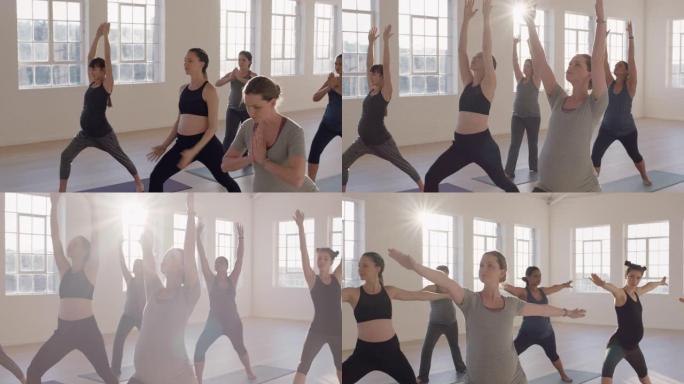 日出时在运动工作室练习战士姿势享受健康生活方式团体健身锻炼的年轻孕妇瑜伽课