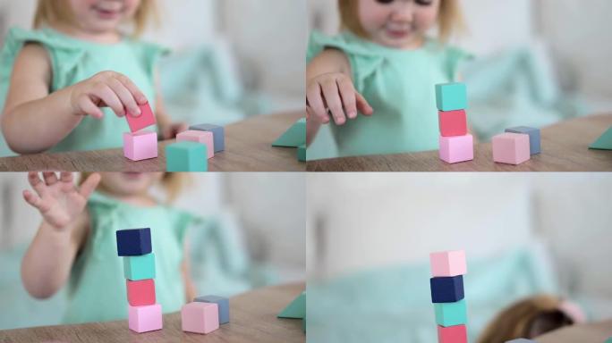 面目全非的小女孩在玩五颜六色的木方块