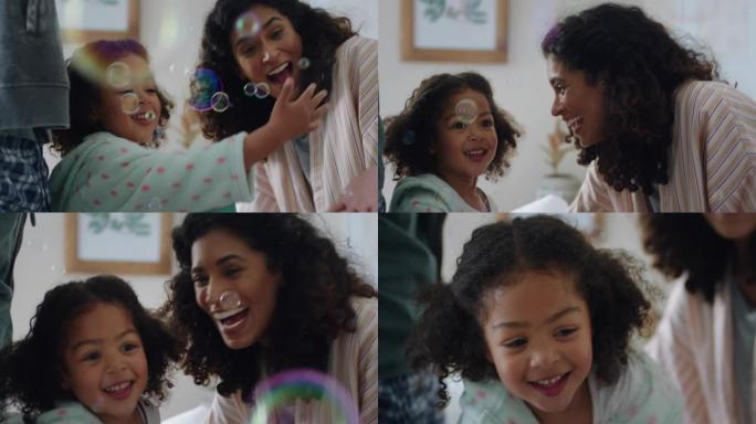 可爱的小女孩在家玩肥皂泡妈妈和爸爸在享受家庭时光时玩得开心4k