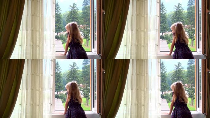 悲伤孤独的孩子看着窗外的玻璃，沉思无聊的女孩