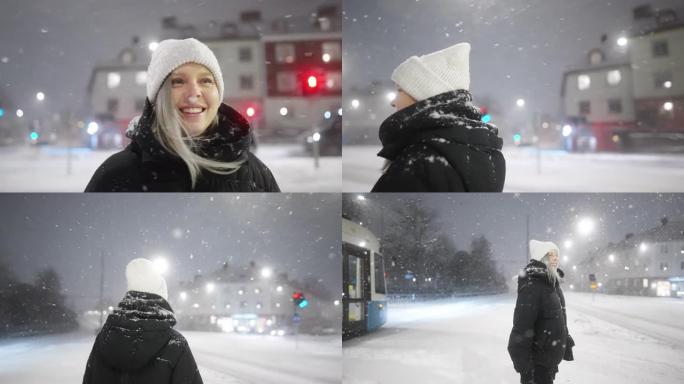 一个女人站在城市里，看着降雪