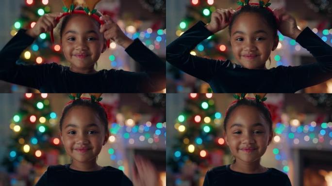 肖像可爱的非洲裔美国女孩庆祝圣诞节穿着有趣的驯鹿鹿角享受节日，五颜六色的灯光在家里玩得开心4k镜头