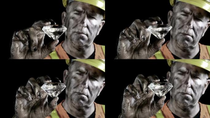 一个珍贵的宝石矿工检查他的巨大钻石发现的概念视频。