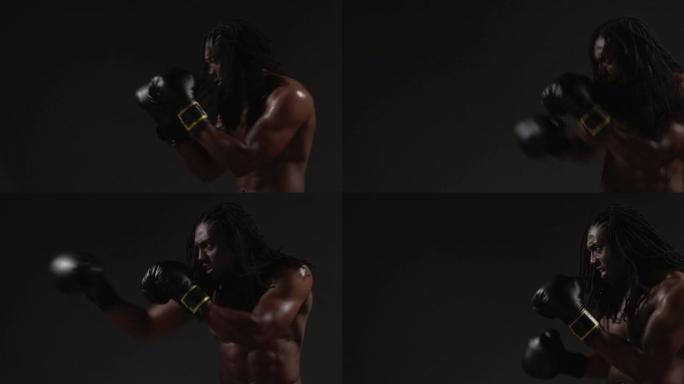 拳击，非裔美国人拳打脚踢，黑色背景