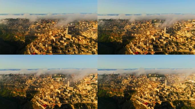 无人机在山上的小镇上拍摄雾