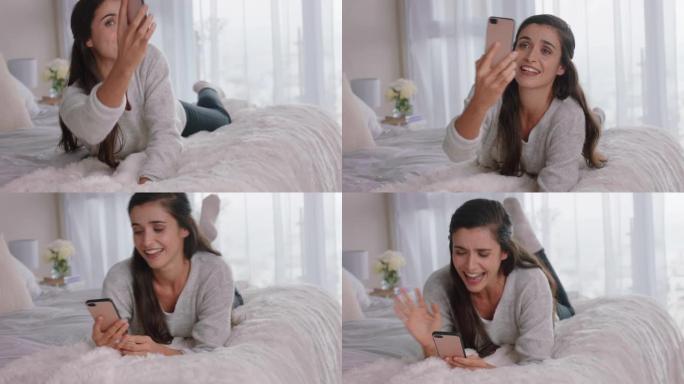美丽的女人用智能手机视频聊天，和朋友聊天，享受躺在床上放松的谈话