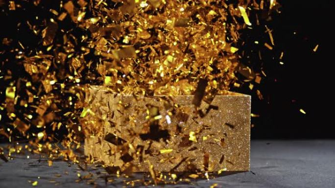 闪闪发光的金色盒子的SLO MO LD盖子开口和五彩纸屑爆裂