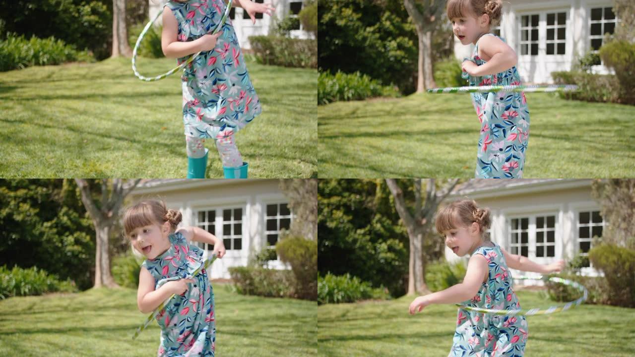 小女孩玩呼啦圈玩具快乐孩子玩游戏户外娱乐阳光明媚的后院花园享受童年4k