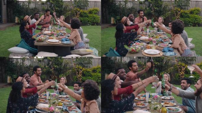 快乐的朋友庆祝烤面包享受花园派对晚餐庆祝友谊坐在餐桌上玩得开心周末在家聚会4k镜头