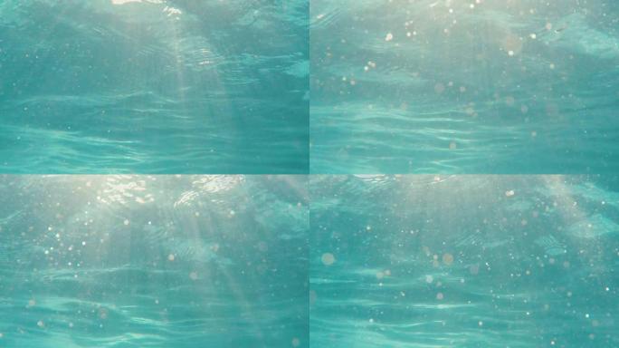海水的水下视图，阳光照在4k镜头表面