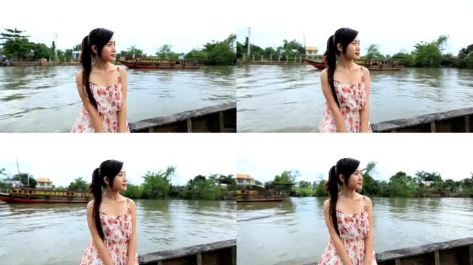 享受湄公河巡游的年轻女子