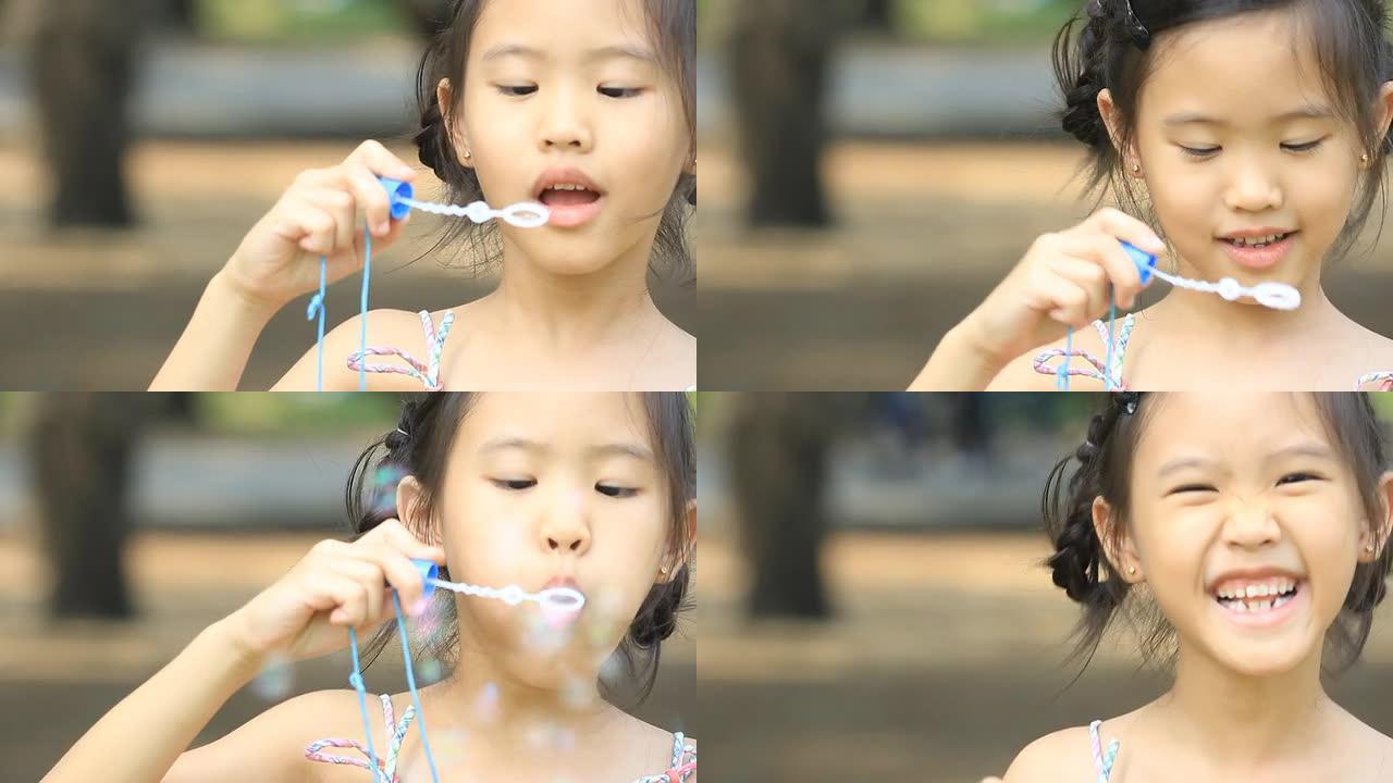 亚洲小孩玩泡泡玩得开心