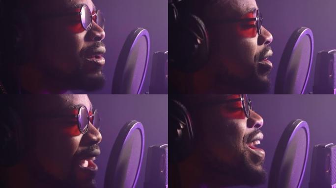 情绪化的黑人歌手在音乐录音室录制新歌，特写