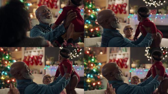 非裔美国人家庭圣诞祖父抱着女婴亲吻孙女骄傲快乐的祖父母在家享受节日团圆4k