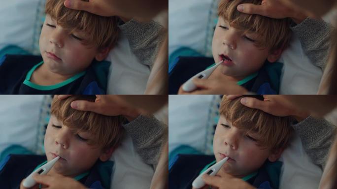 母亲照顾生病的孩子躺在床上，流感用温度计测量体温，小男孩在家发烧，妈妈在保健