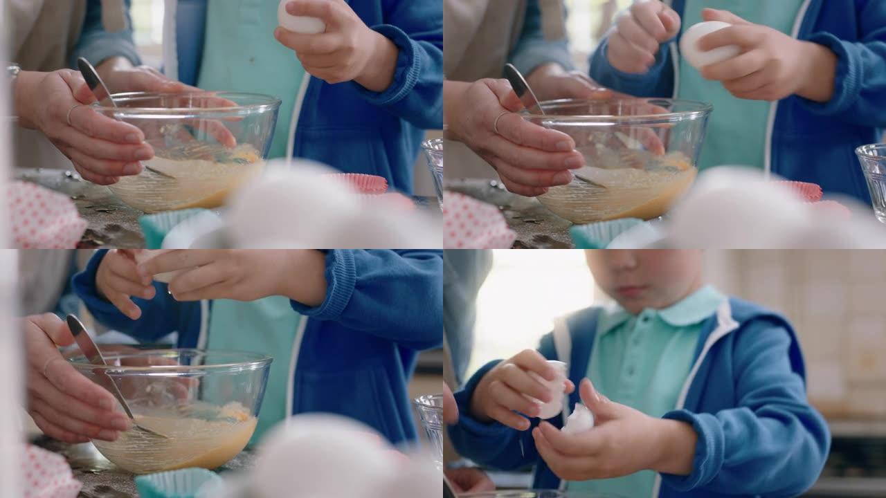可爱的小男孩帮助妈妈在厨房里烘烤混合配料把鸡蛋打碎成碗里，在家和妈妈一起准备食谱