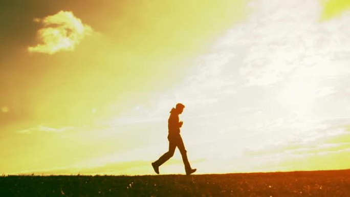 运动员慢跑训练户外健康生活方式日落