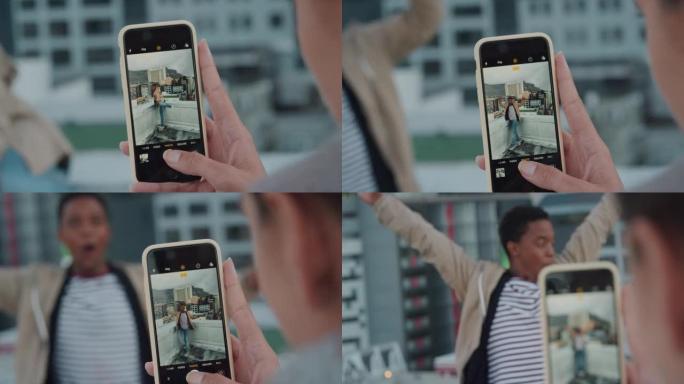使用智能手机拍摄朋友摆姿势的照片的特写女人在日落时享受屋顶派对庆祝活动在社交媒体上分享城市疯狂周末