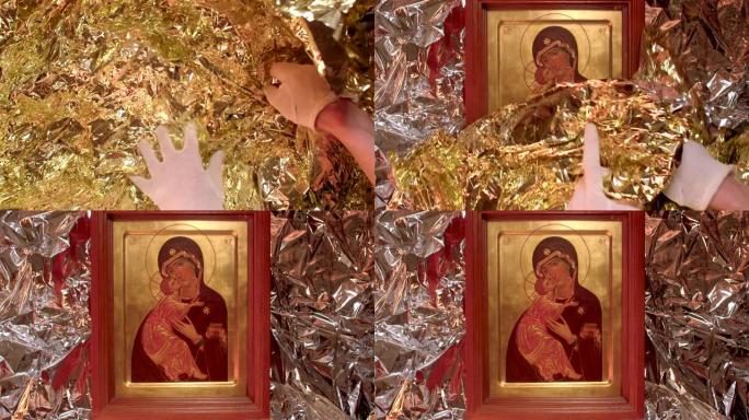 图标祝福圣母玛利亚和耶稣上帝的孩子，作为金色包装的礼物。