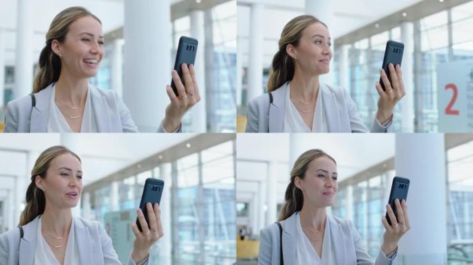 漂亮的商务女性在机场用智能手机和客户视频聊天，讨论工作，成功的女主管用手机4k