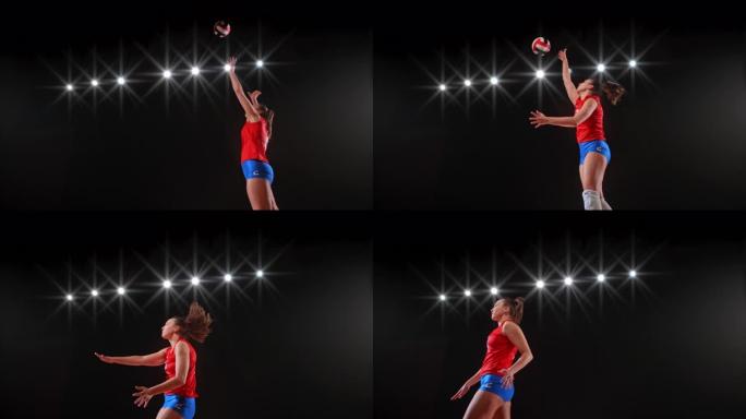 穿着红色服装的SLO MO女子排球运动员跳高到空中并击球