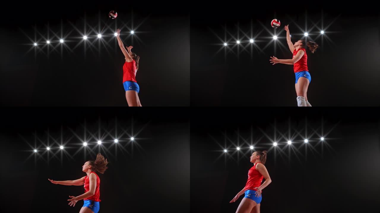 穿着红色服装的SLO MO女子排球运动员跳高到空中并击球