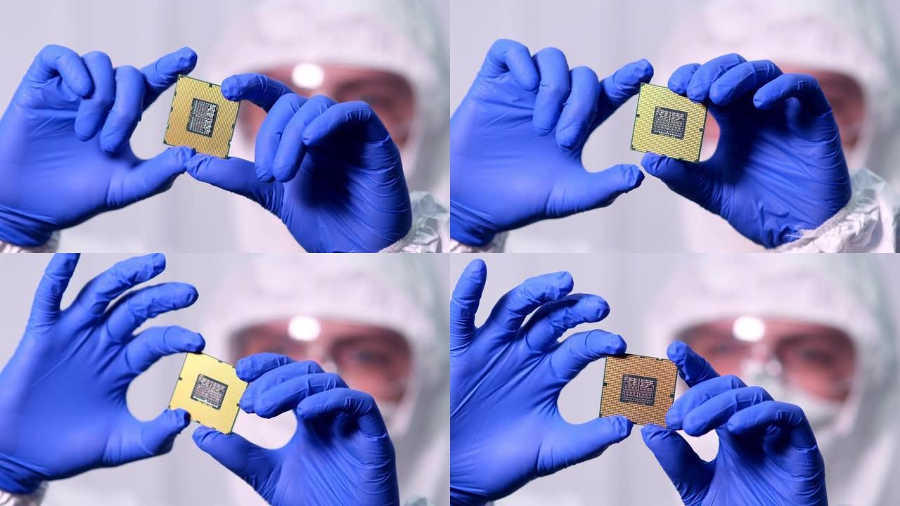 未来技术概念: 无菌工作服的工程师戴着手套拿着计算机微芯片并对其进行检查。CPU处理器数字化与数据线