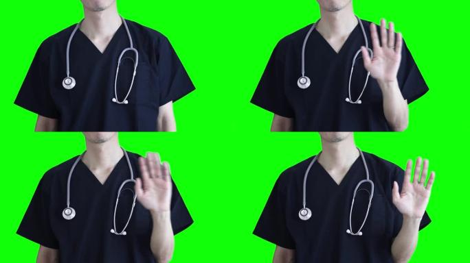 一名医务人员向他的胸口挥手告别。医生或护士的上半身。