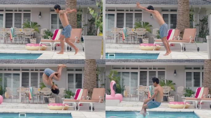 年轻的亚洲男子跳进游泳池做翻筋斗，在温暖的夏日里尽情享受游泳4k